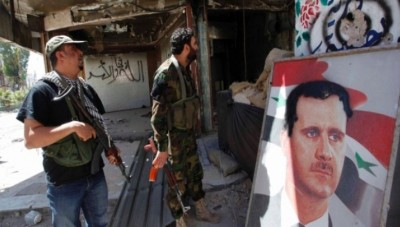قوات ماهر الأسد تسرق المحال التجارية في دير الزور وتقوم بتفجيرها لطمس جرائمها